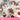 Assorted ice cream bowls with fruits and toppings on a wooden surface, featuring the year 2016 at the bottom.