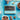 Box of Booja-Booja Chocolate Salted Caramel Chocolate Truffles on a blue background surrounded by chocolate truffles, ingredients and decorative items. 