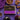 Box of Booja-Booja Deeply Chocolate Truffles on a purple background surrounded by chocolate truffles and decorative items. 