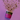 Booja-Booja Deeply Chocolate small ice cream tub on a purple background with chocolate pieces scattered around.